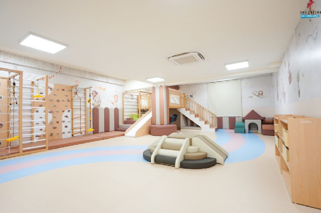 An indoor climbing and soft-play room at Skill Stork ELC