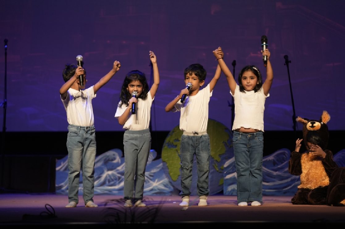 Children performing on stage at a Skill Stork ELC celebration